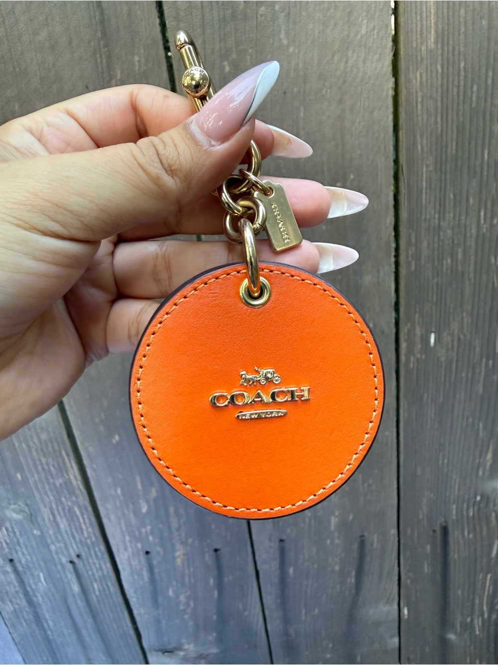 Coach Orange Round Leather Bag Charm with Gold Hardware